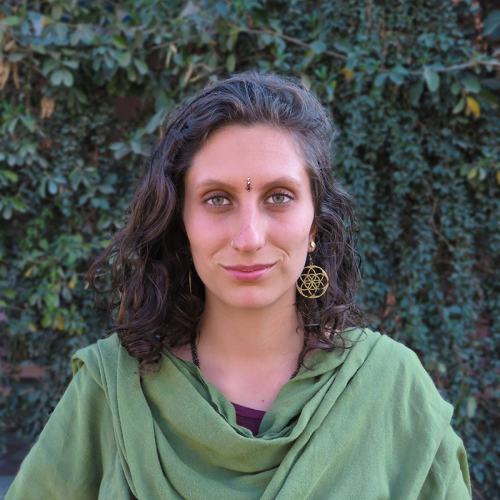 Lalita Vega, yoga and meditation teacher, wearing green shawl, smiling outdoors